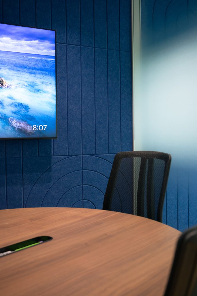 Sound absorbing wall panels in office reducing echo for video conferencing and meetings