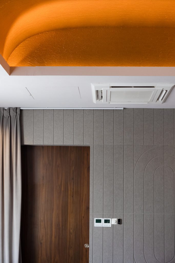 Acoustic wall panels forming a refined textured surface within private dining room