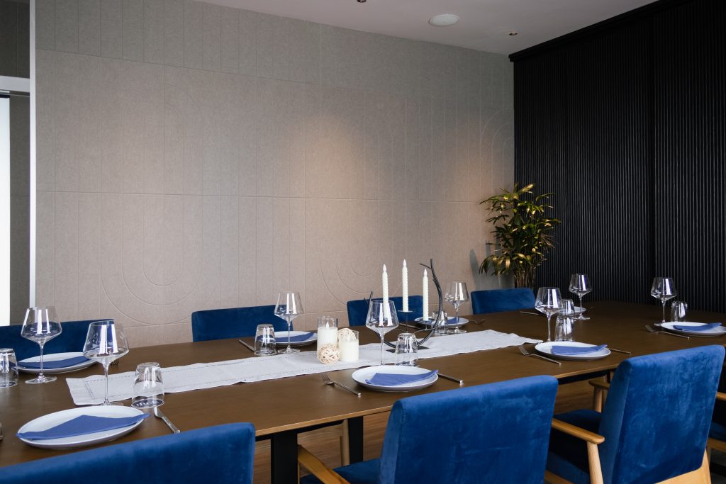 Sound absorbing wall panels in dining space reducing echo and overlapping voices
