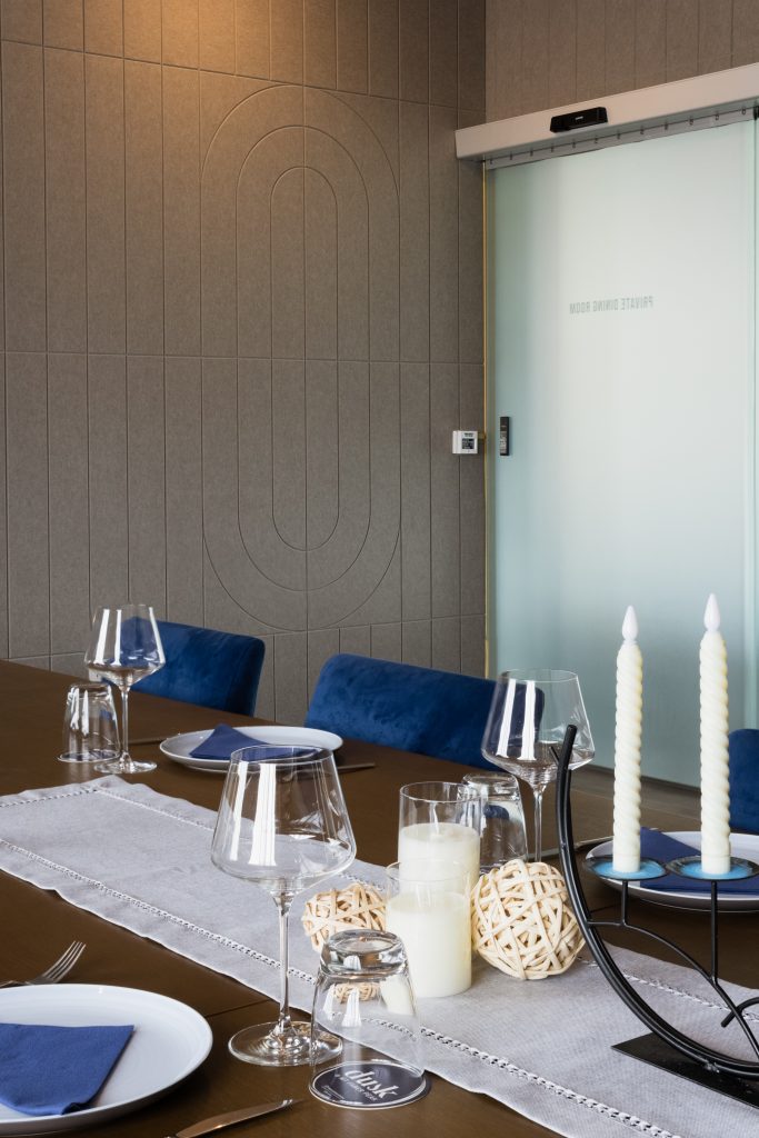Wall acoustic panels supporting clear conversations in restaurant dining environment