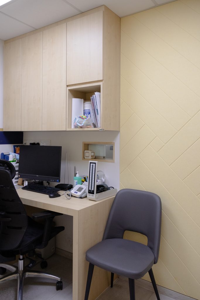 Sound absorbing wall panels in medical room reducing echo during consultations
