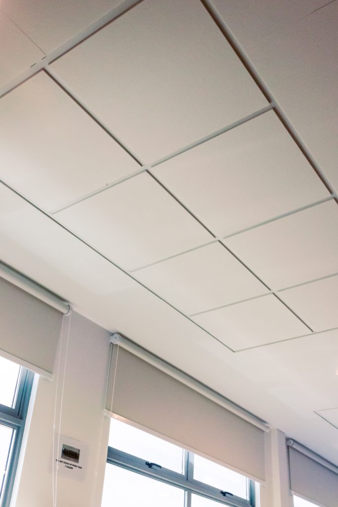 White acoustic ceiling panel system improving acoustics in church interior Singapore