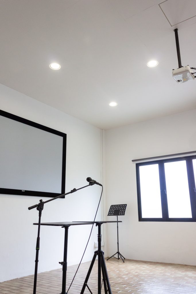 Acoustic panels aligned precisely on white ceiling for clean and continuous finish