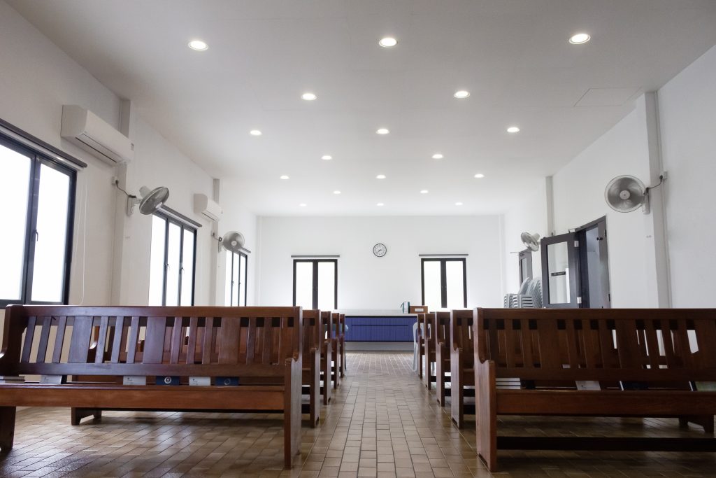 Acoustic ceiling panels in church worship hall improving sound clarity and reducing echo