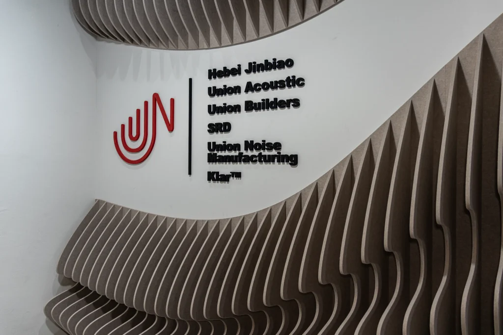 Klar Wave Wall acoustic panels forming a sculptural entrance wall at a commercial office in Singapore