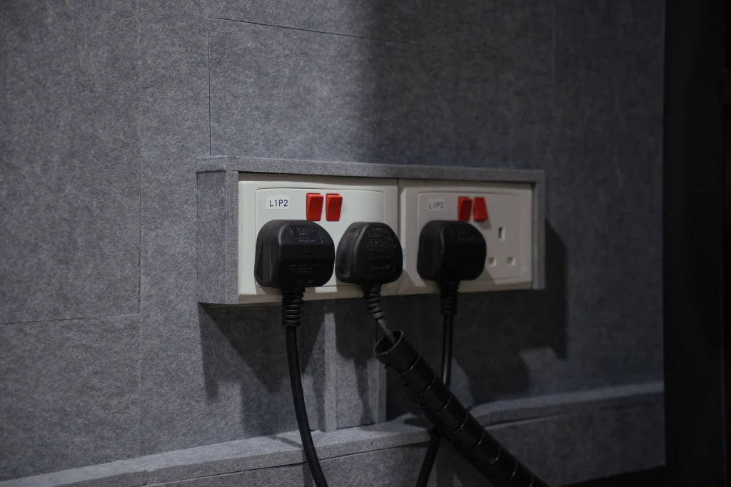Power sockets recessed into Klar™ Essentials CM19 Moonlight acoustic panels at Weave creative office Singapore