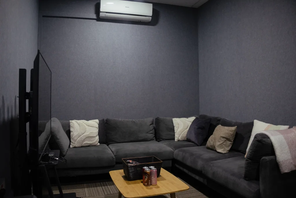 Klar™ Essentials CM19 Moonlight acoustic wall panels behind sofa at Weave creative production office Singapore
