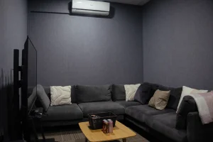 Klar™ Essentials CM19 Moonlight acoustic wall panels behind sofa at Weave creative production office Singapore