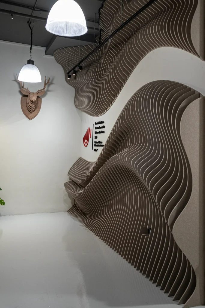 Wave Wall acoustic panels covering the main entrance wall of a commercial office in Singapore
