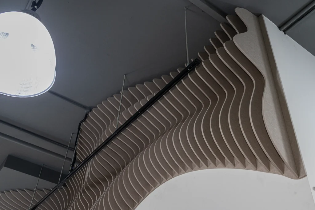 Klar Wave Wall acoustic panels installed overhead at the entrance of Union Noise Group office in Singapore