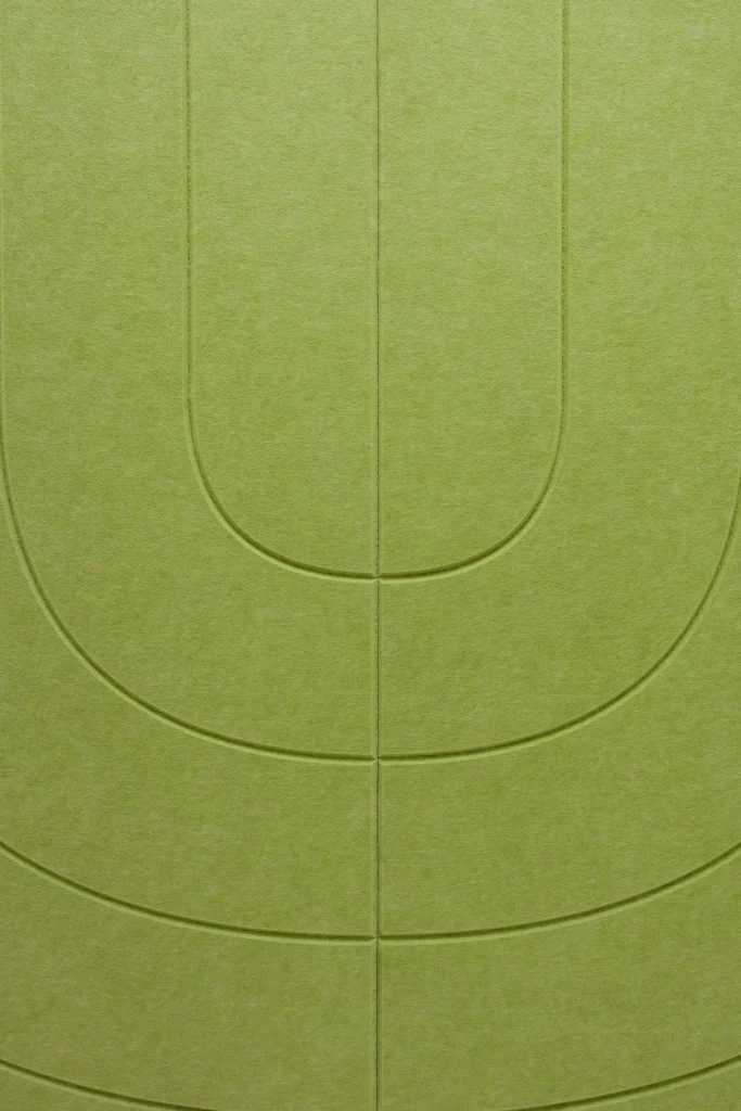 Close-up of the custom V-groove arch pattern on a Klar™ Grooves acoustic panel in Peridot [VD04]